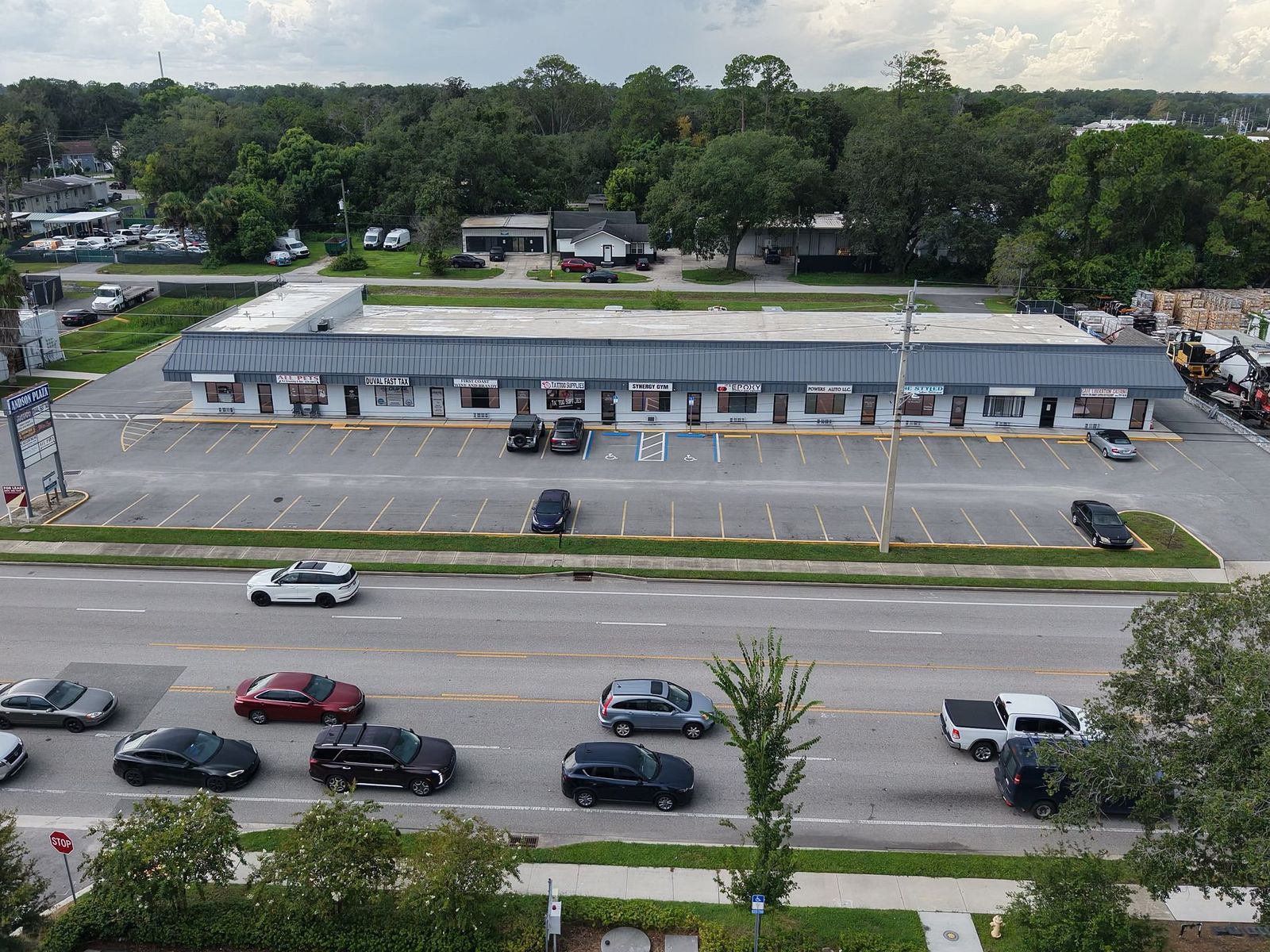 Powers Ave frontage at Andson Plaza with striped parking for tenants and visitors